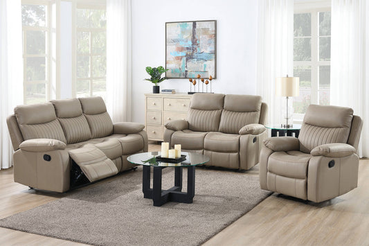 Beige reclining sofa set in a living room with a coffee table and decor.
